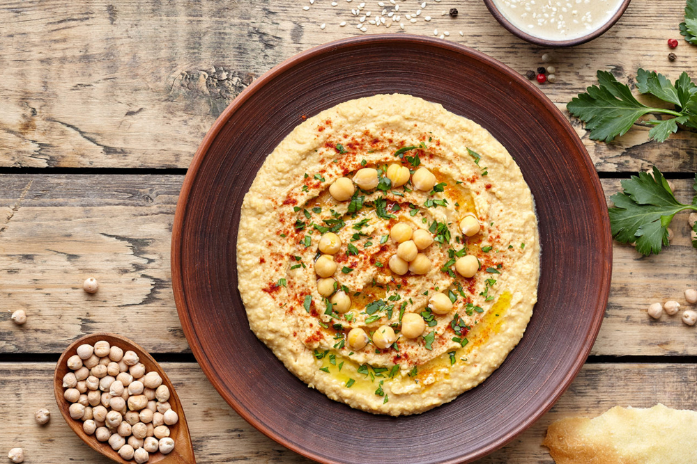 Hummus traditional eastern homemade arabic chickpea dip paste with paprika tahini and olive oil