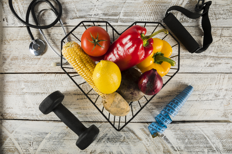 fresh-vegetables-surrounded-by-fitness-equipments-stethoscope-measuring-tape (1)